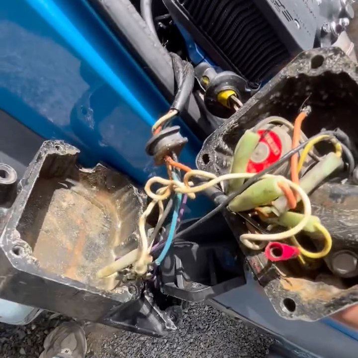 Looking inside an opened jet ski electrical box