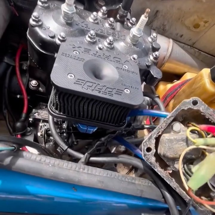 A Kawasaki 650 jet ski with the electrical box opened up for repair